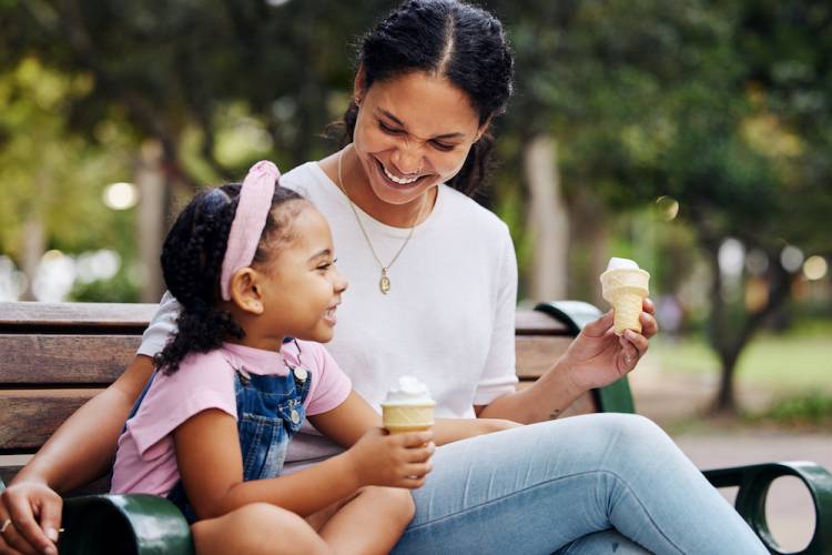 mother and daughter enjoy ice cream